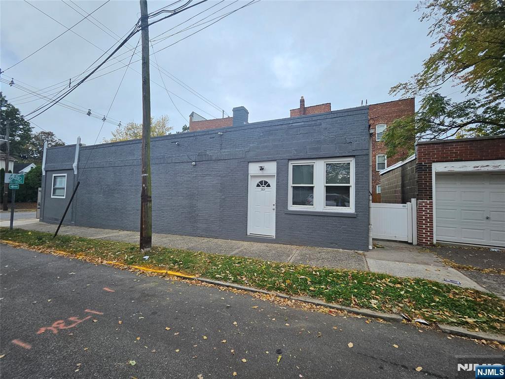 196 Fort Lee Road Teaneck, NJ 07666 - Photo 2 of 13 a house that has a tree in front of it