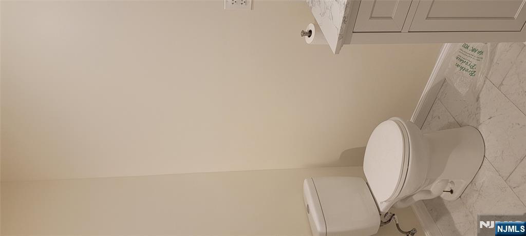 196 Fort Lee Road Teaneck, NJ 07666 - Photo 4 of 13 a white toilet sitting next to a shower