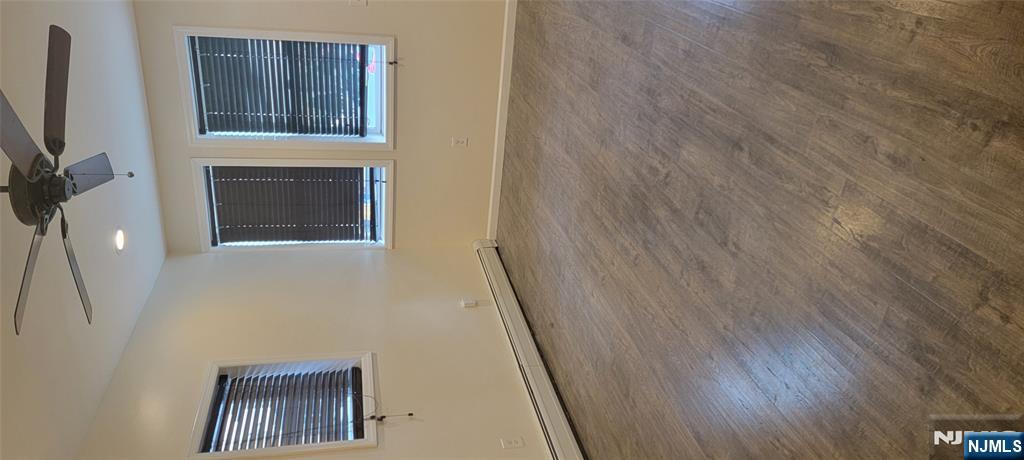 196 Fort Lee Road Teaneck, NJ 07666 - Photo 5 of 13 a view of an empty room with a window