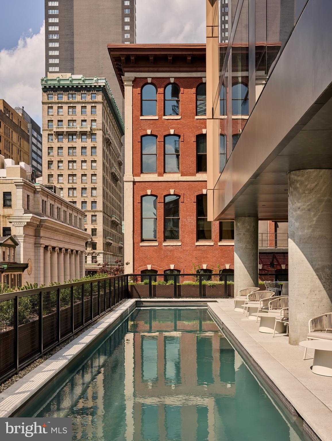 1134 Sansom Street, Unit 1B1706 Philadelphia, PA 19107 - Photo 27 of 33 a view of balcony with a lot of windows and plants
