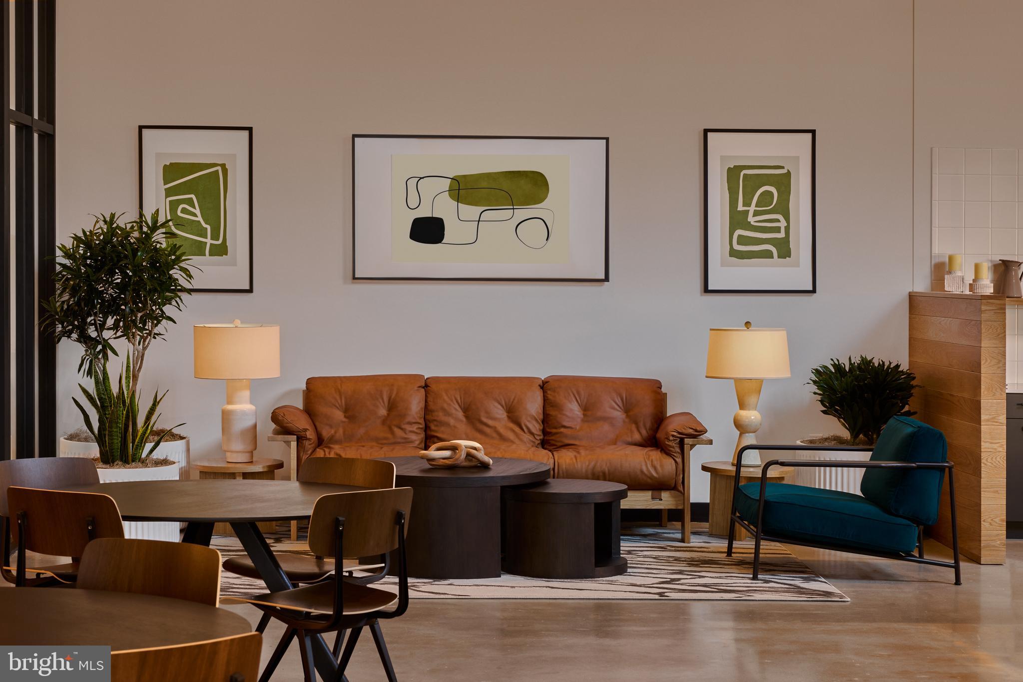 1134 Sansom Street, Unit 1B1706 Philadelphia, PA 19107 - Photo 6 of 33 a living room with furniture and a potted plant