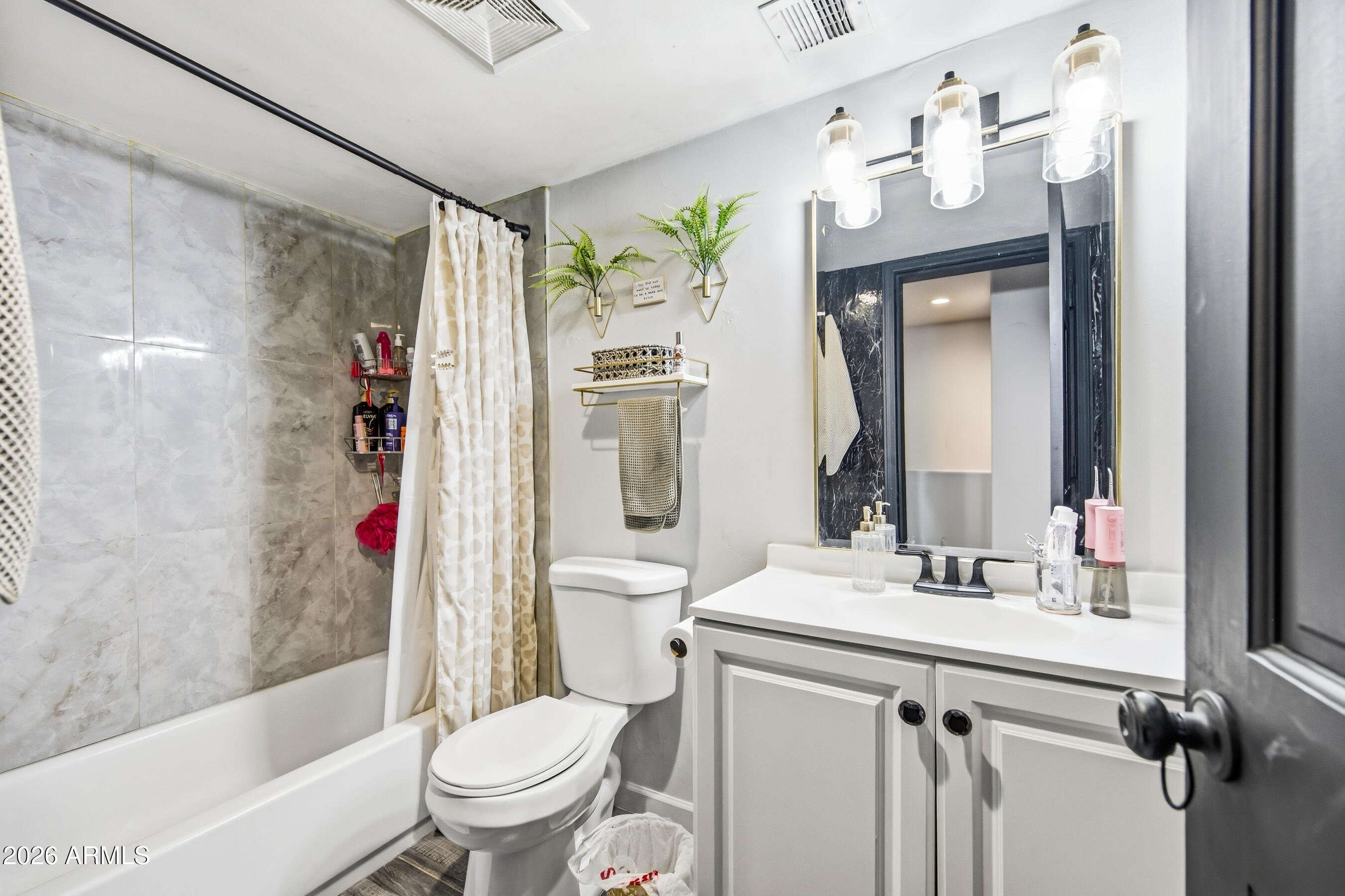 1702 East Ocotillo Road, Unit 1 Phoenix, AZ 85016 - Photo 23 of 27 a bathroom with a sink toilet and shower