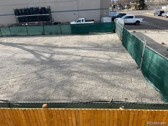 a view of a swimming pool with a yard