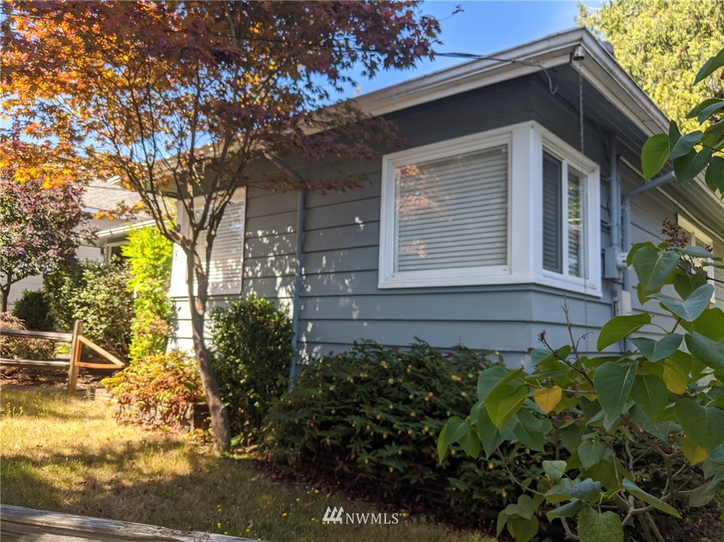 938 North 86th Street Seattle, WA 98103 - Photo 1 of 1 a view of a house with a flower garden