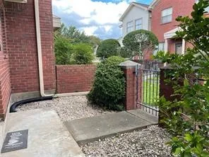 a view of a pathway both side of house