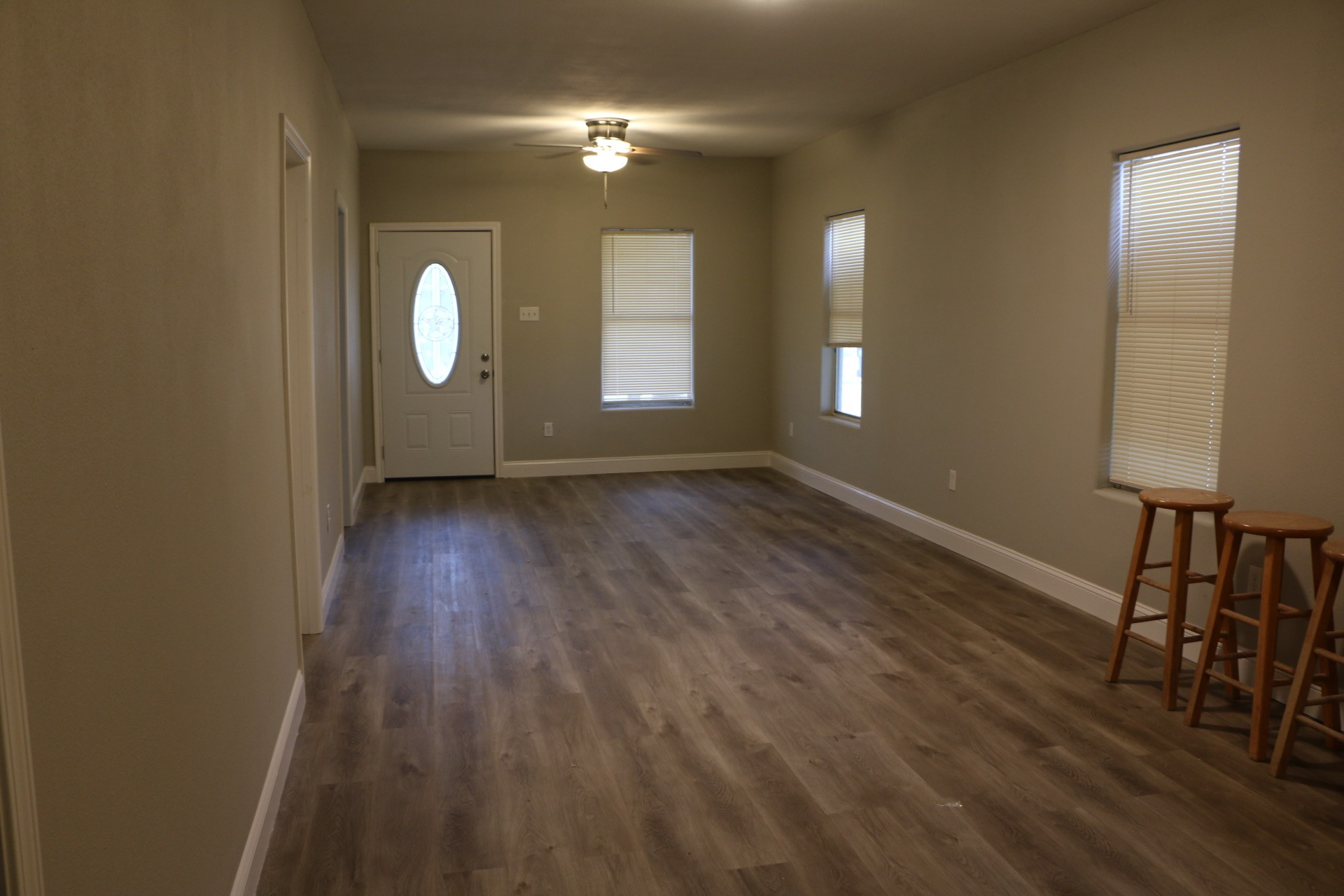 1014 West 4th Street Freeport, TX 77541 - Photo 4 of 16 wooden floor in an empty room with a window