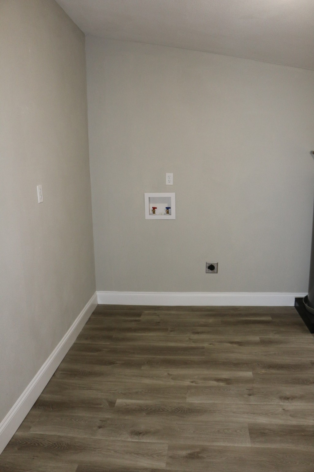 1014 West 4th Street Freeport, TX 77541 - Photo 6 of 16 a view of a room with wooden floor and white walls