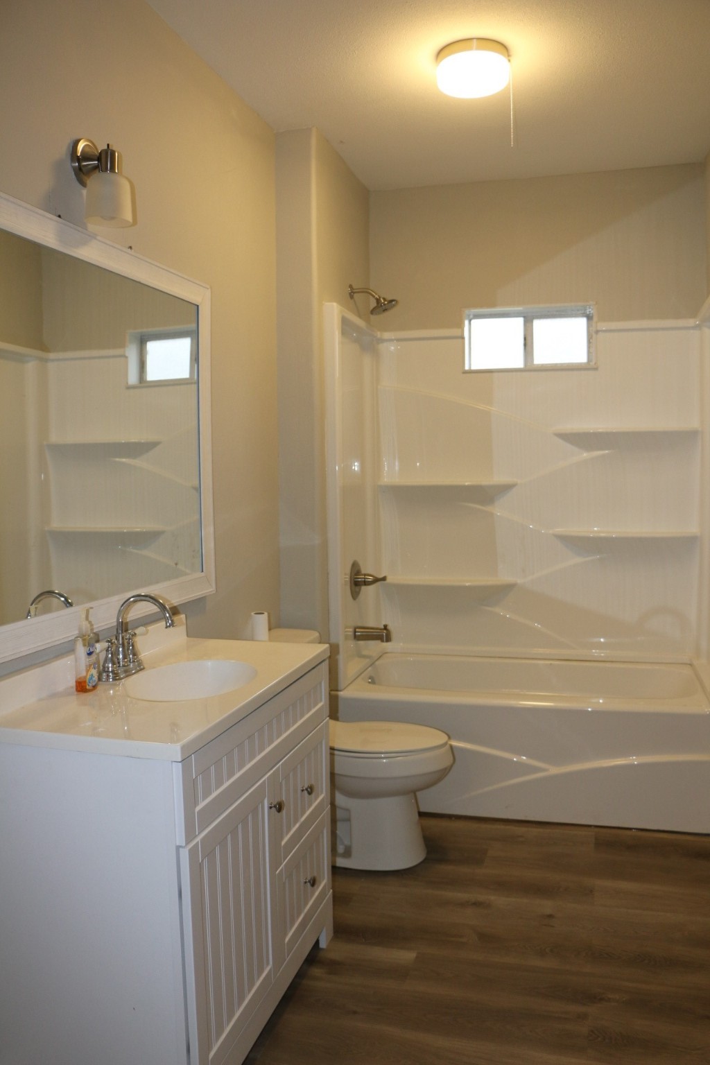1014 West 4th Street Freeport, TX 77541 - Photo 9 of 16 a bathroom with a double vanity sink toilet and shower