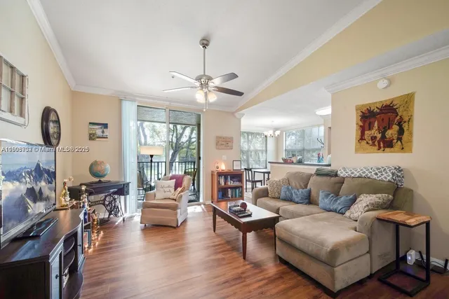 a living room with furniture or couch and a wooden floor