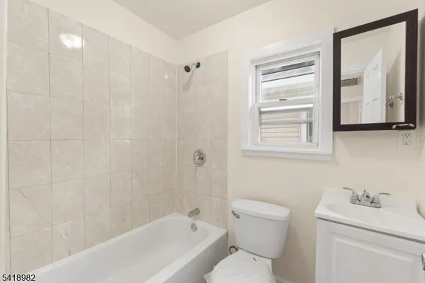 a bathroom with a toilet a sink and a bathtub