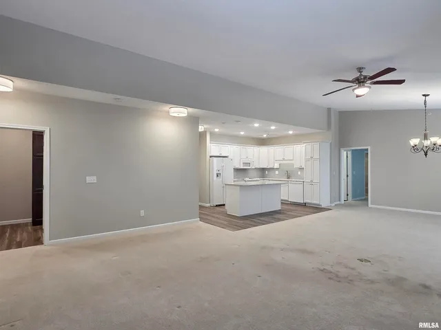 a view of a livingroom with a kitchen