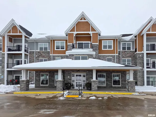 a view of a swimming pool with outdoor seating