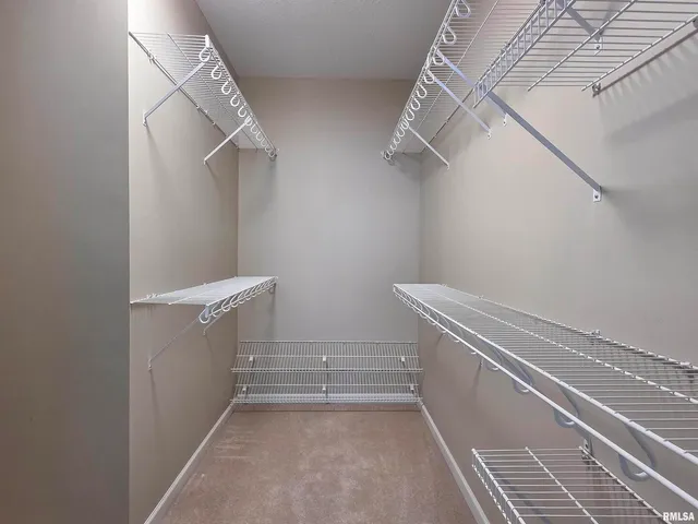 a bathroom with a sink a toilet a light fixture and a mirror