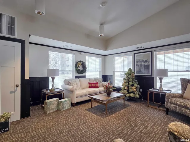 a living room with furniture or couch and a large window