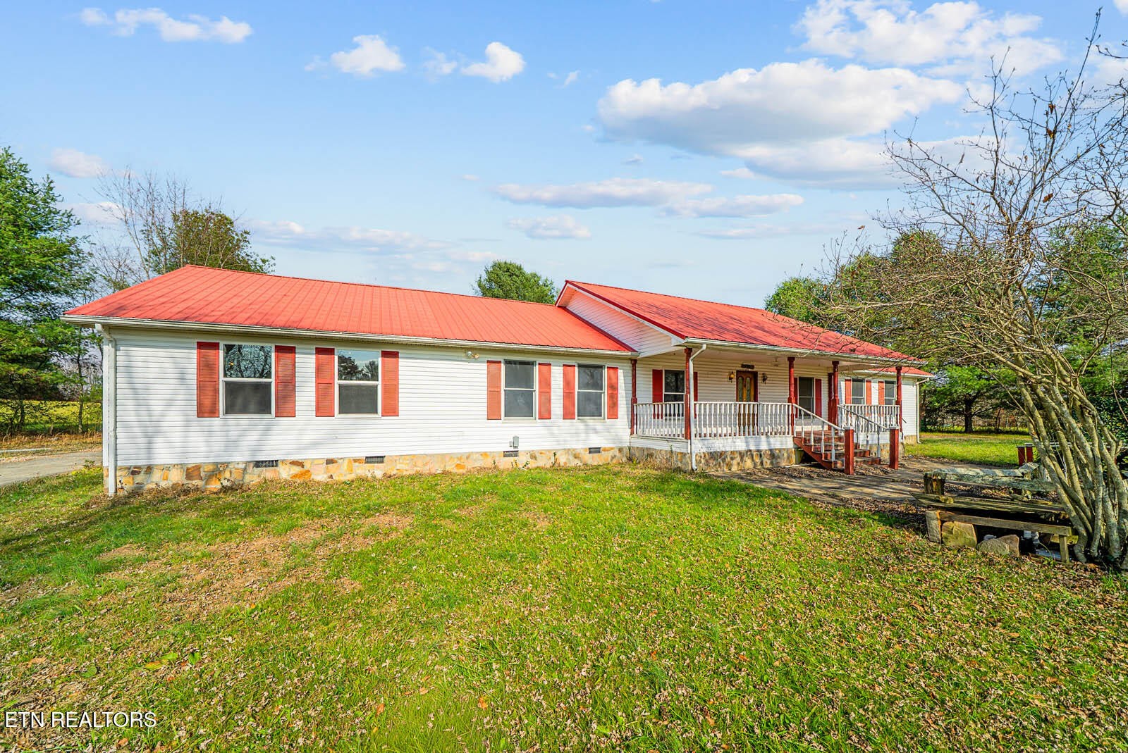 a front view of house with yard and swimming pool