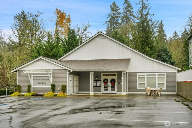 a front view of a house with a garden and porch