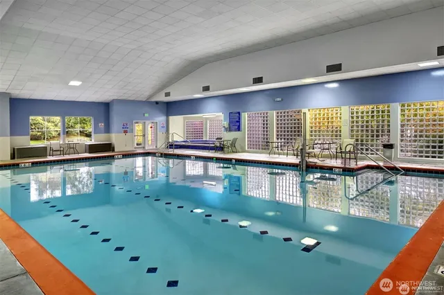 a kitchen with stainless steel appliances granite countertop a stove a sink and a wooden cabinets