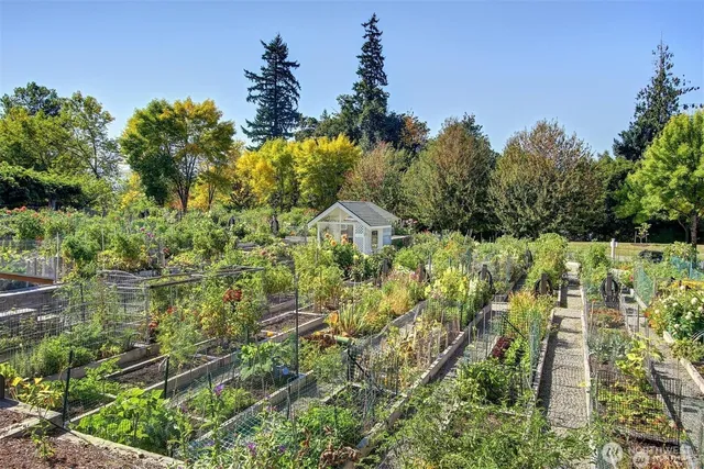 a street sign on a sidewalk next to a road