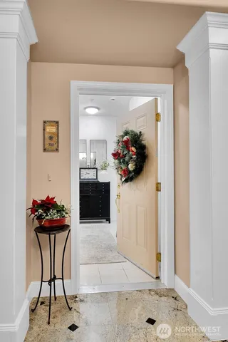 a view of a hallway and a kitchen
