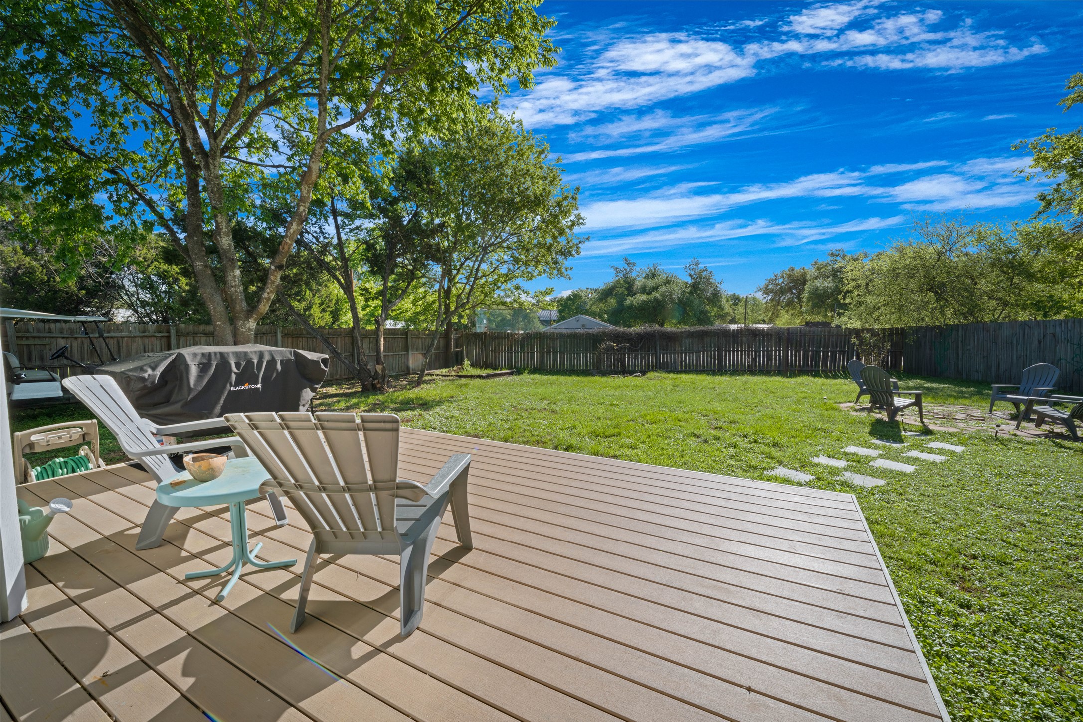 131 Campfire Circle Wimberley, TX 78676 - Photo 28 of 40 a view of a chairs and table on the terrace