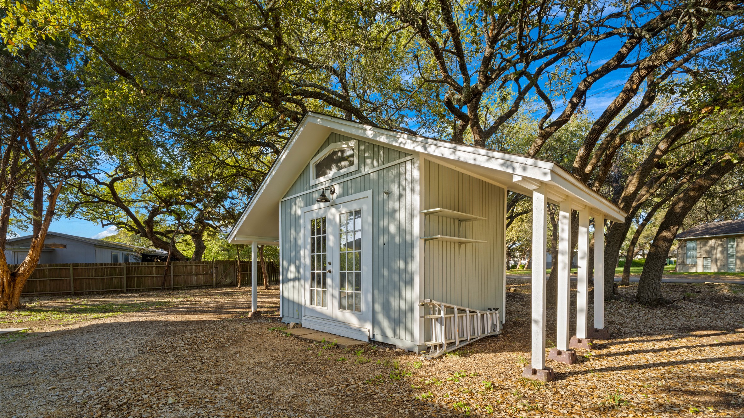 131 Campfire Circle Wimberley, TX 78676 - Photo 31 of 40 a view of a house with a large tree