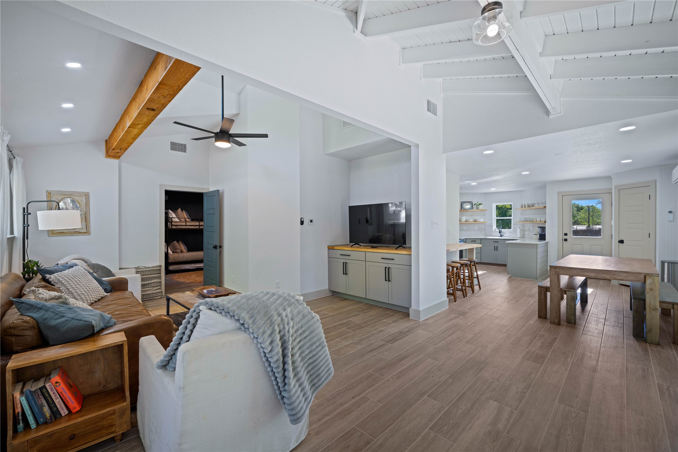 131 Campfire Circle Wimberley, TX 78676 - Photo 4 of 40 a living room with furniture and a flat screen tv
