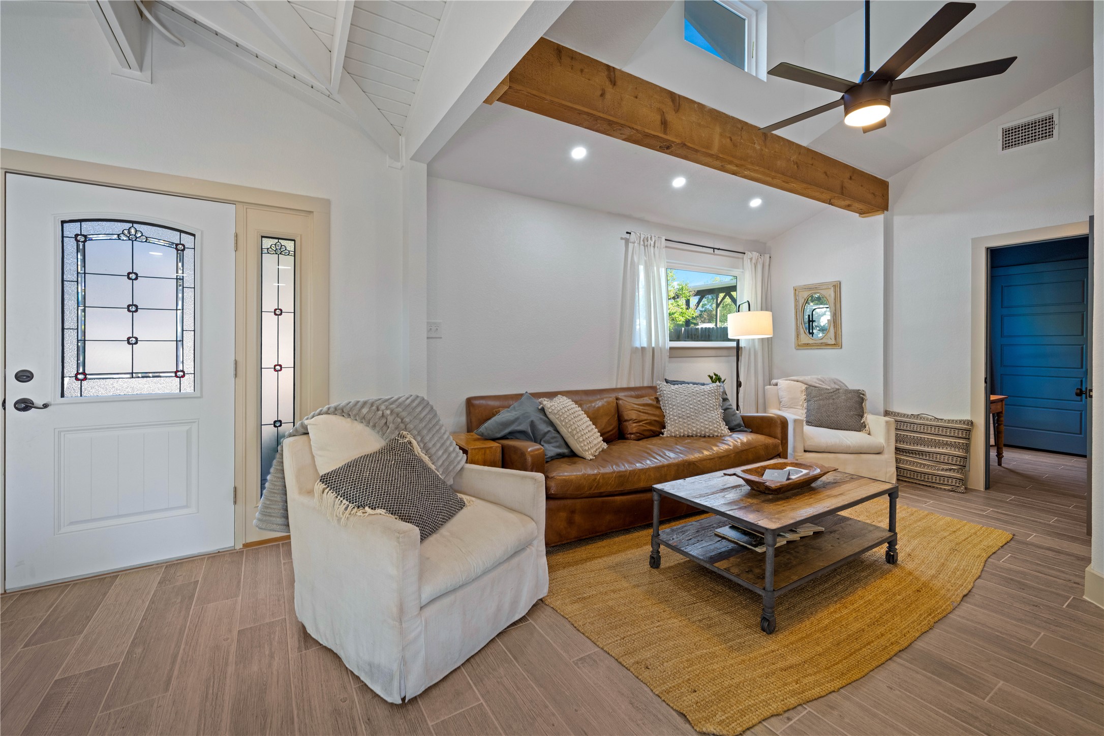 131 Campfire Circle Wimberley, TX 78676 - Photo 5 of 40 a living room with furniture and wooden floor