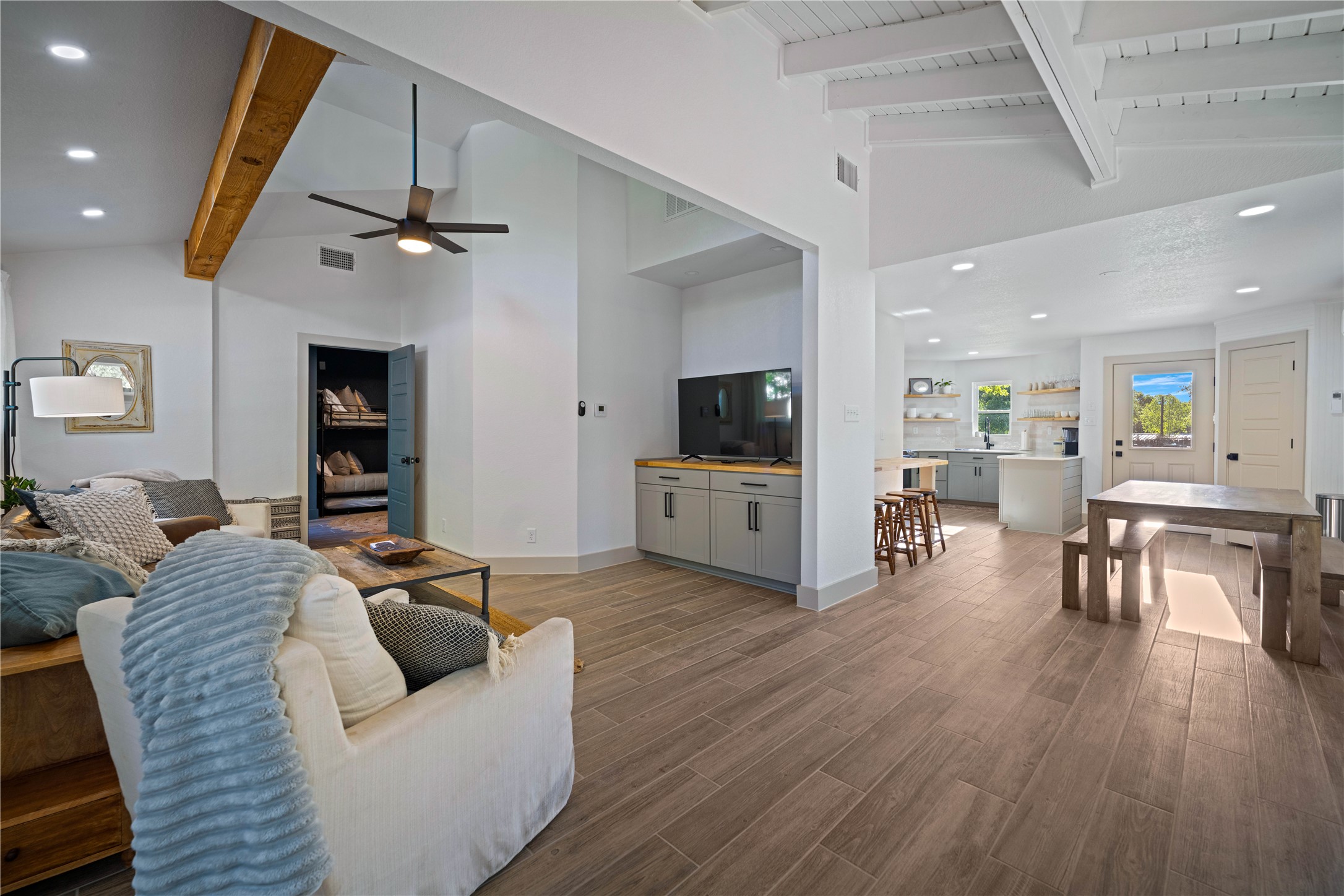 131 Campfire Circle Wimberley, TX 78676 - Photo 9 of 40 a living room with furniture and a flat screen tv