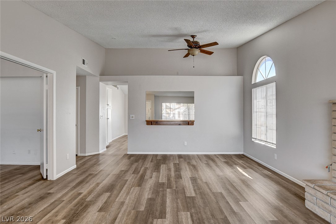 6209 Warm River Road Las Vegas, NV 89108 - Photo 9 of 39 Laminated flooring and high ceilings create a spacious, inviting atmosphere.