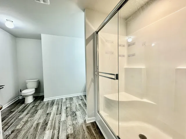 a bathroom with a bathtub and toilet