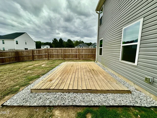 a swimming pool with wooden fence