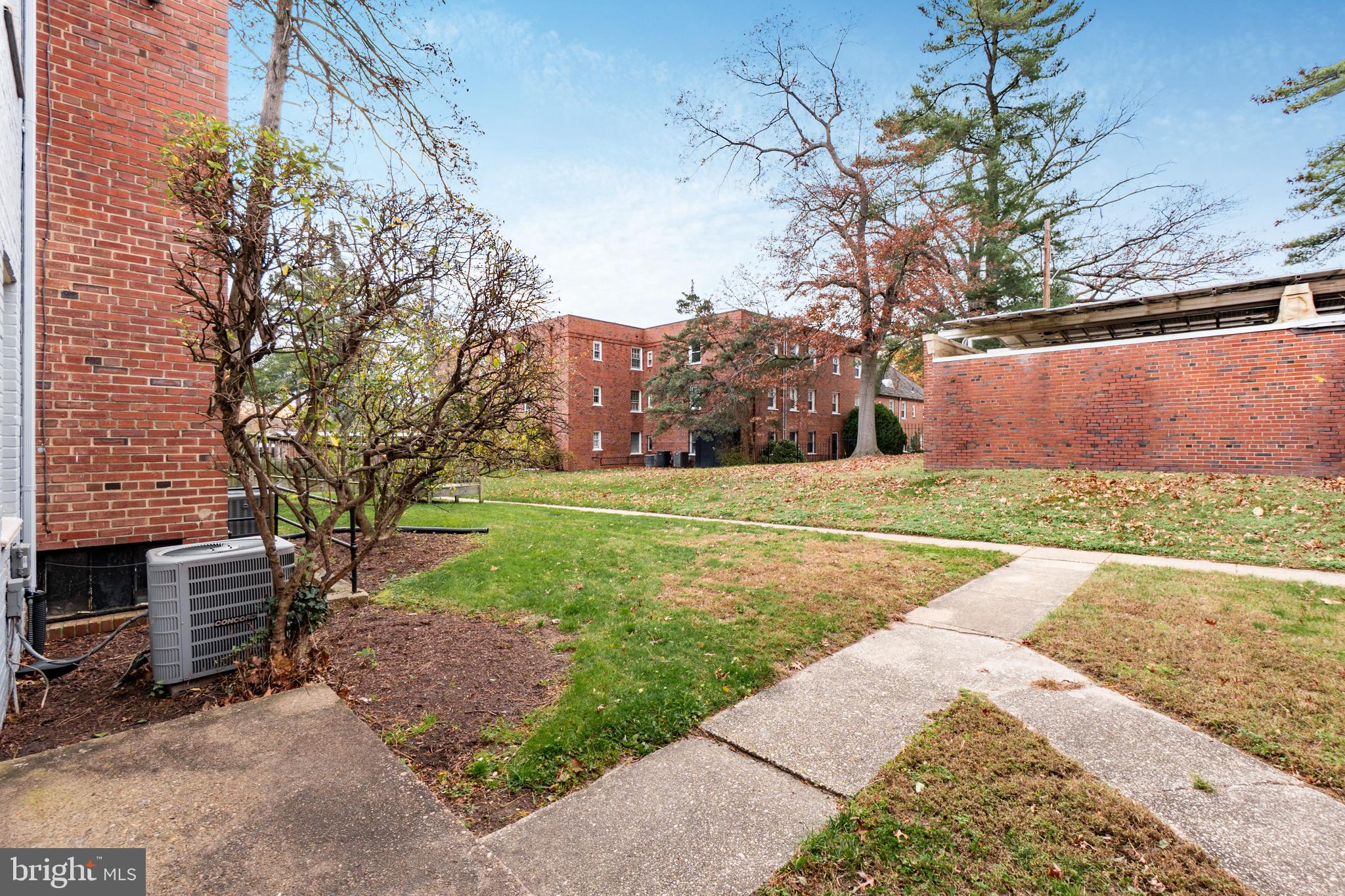 2123 Suitland Terrace Southeast, Unit B Washington, DC 20020 - Photo 23 of 25 a view of a backyard with large trees