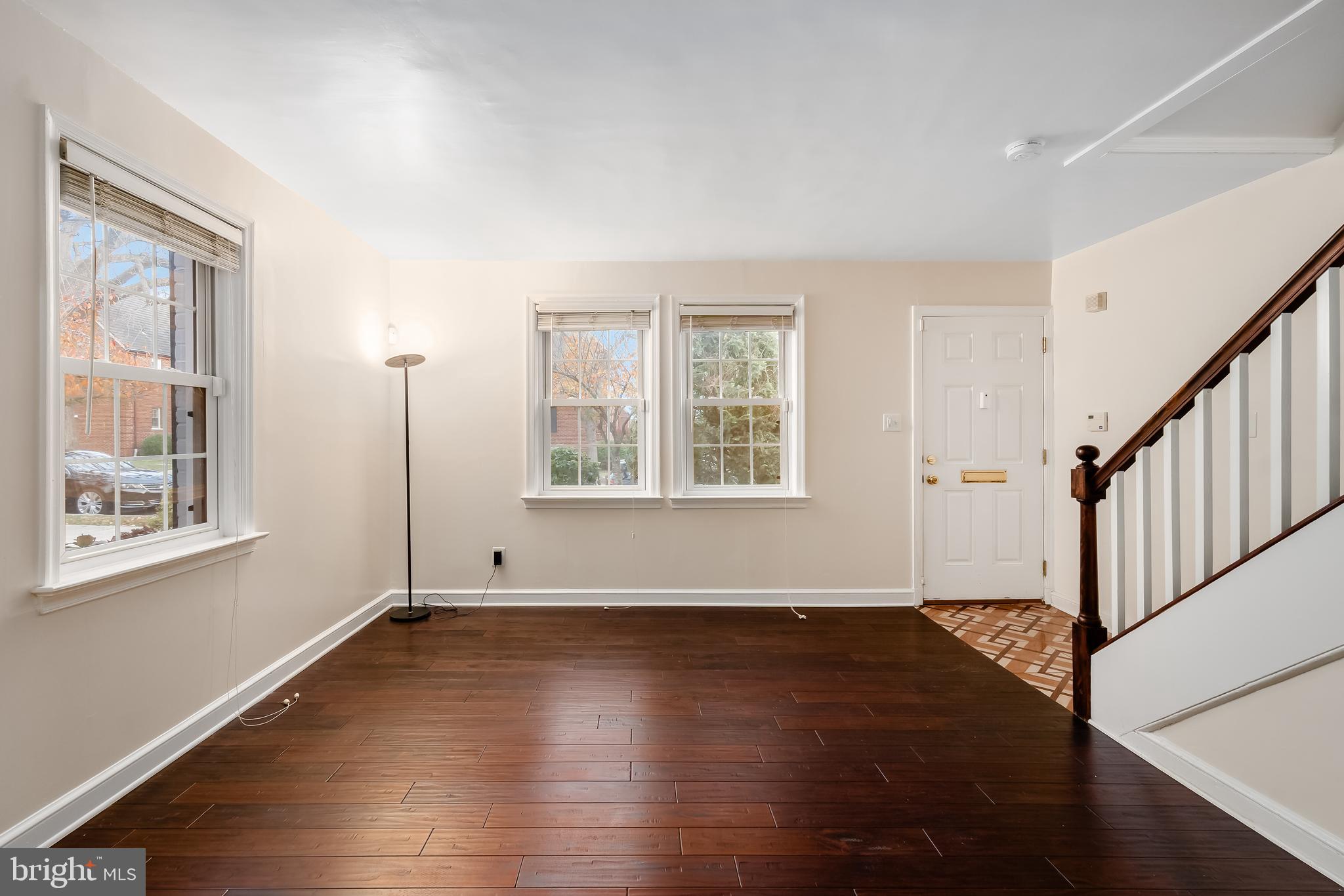 2123 Suitland Terrace Southeast, Unit B Washington, DC 20020 - Photo 7 of 25 wooden floor in an empty room with a window
