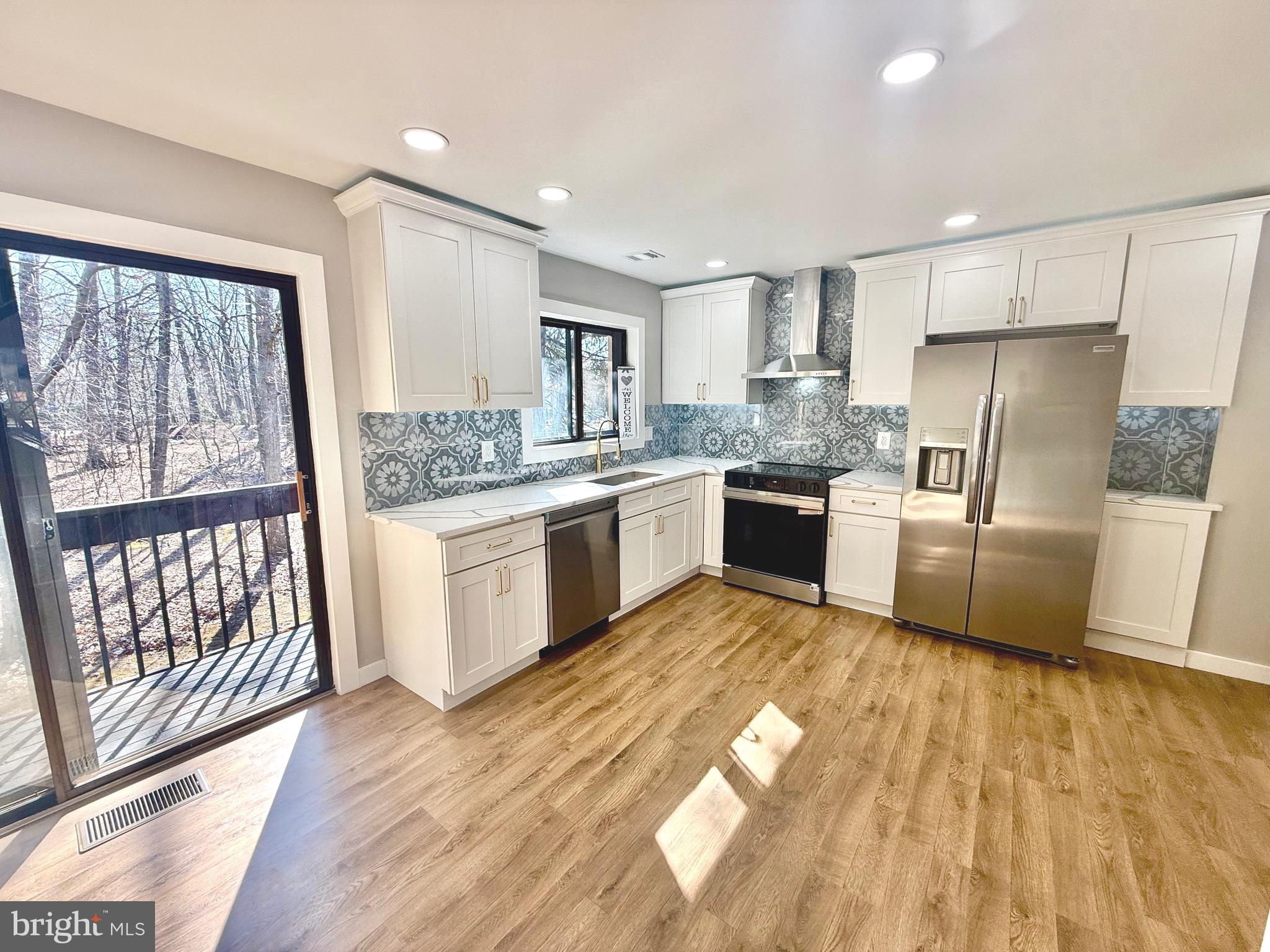 2102 Cartwright Place Reston, VA 20191 - Photo 7 of 22 Open Kitchen to Outdoor Deck