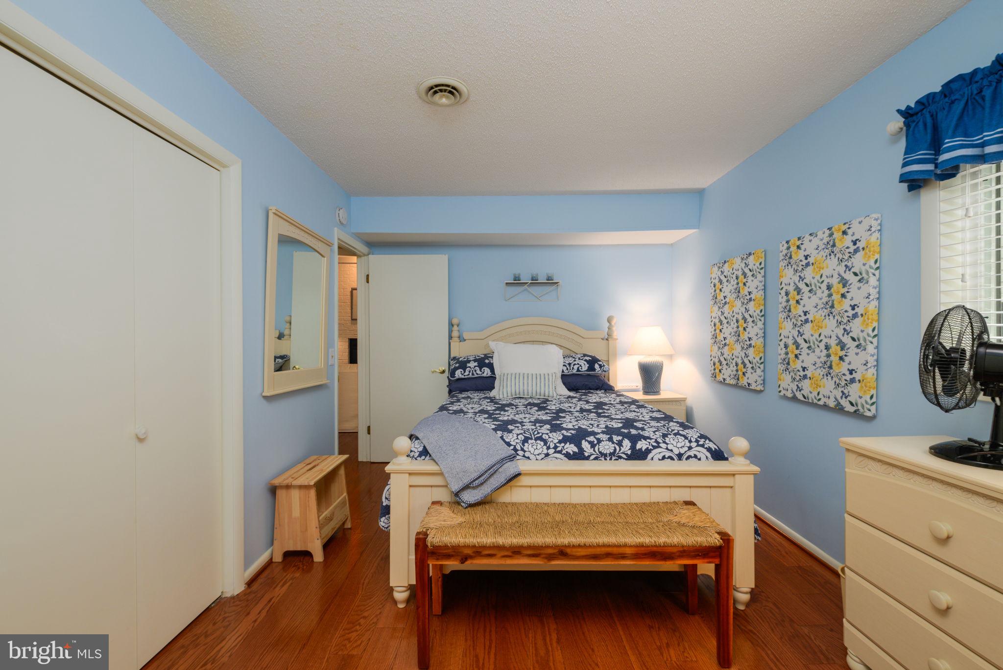 10 Gloucester Road Ocean Pines, MD 21811 - Photo 12 of 37 a bedroom with a bed and a dresser in it