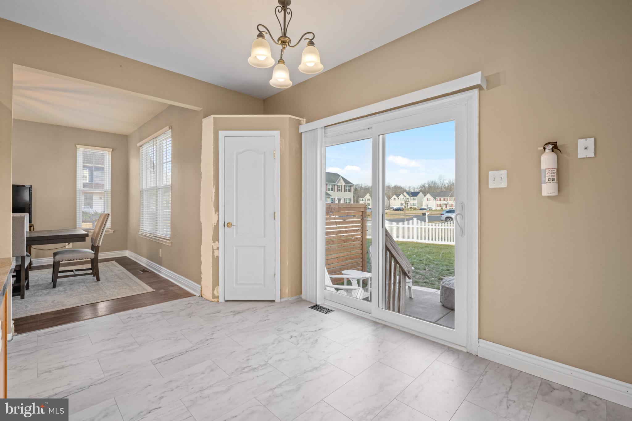 8 Porch Street Clayton, NJ 08312 - Photo 11 of 31 wooden floor in an empty room with a window