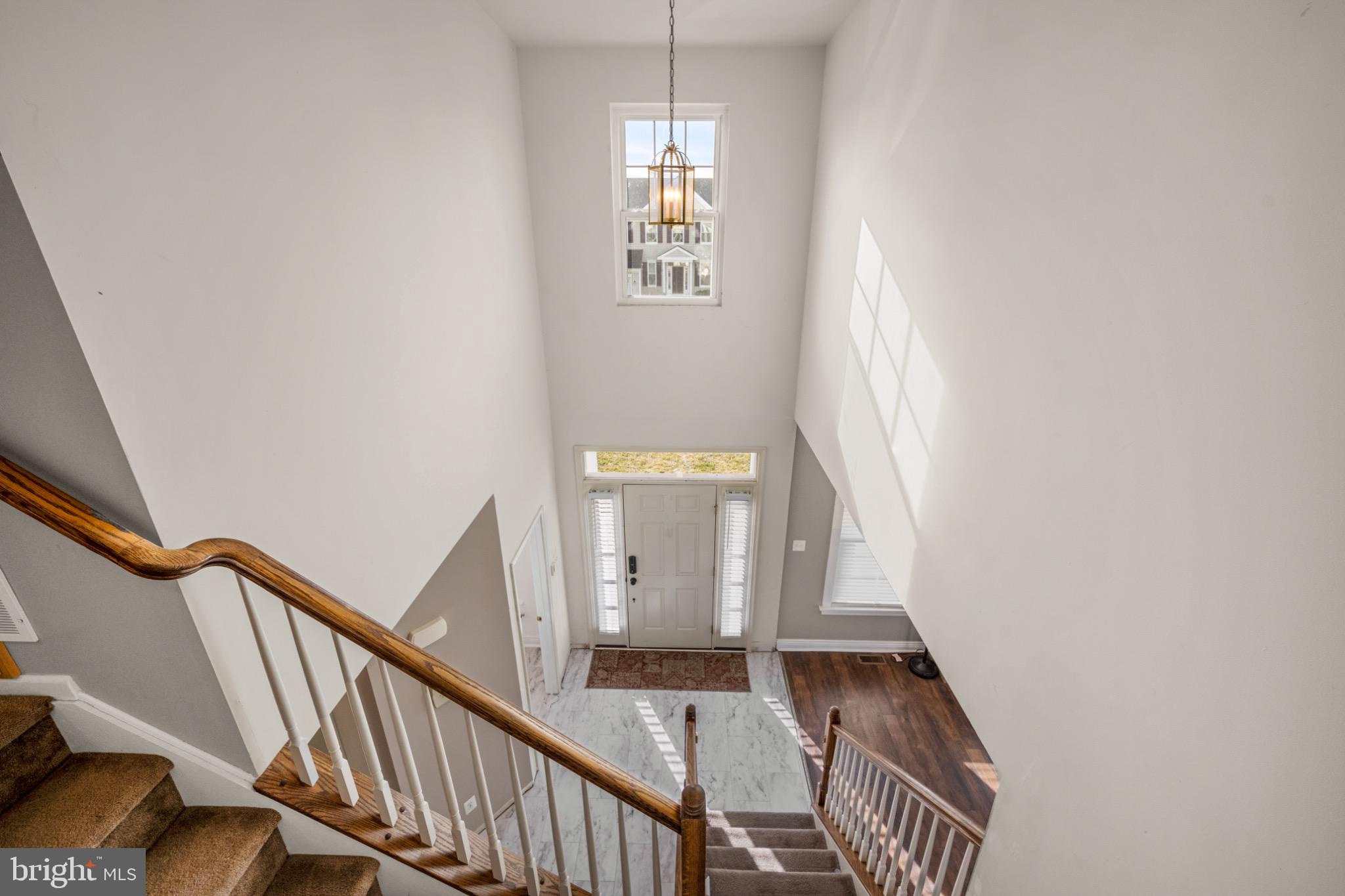 8 Porch Street Clayton, NJ 08312 - Photo 16 of 31 a view of a hallway with wooden floor and stairs