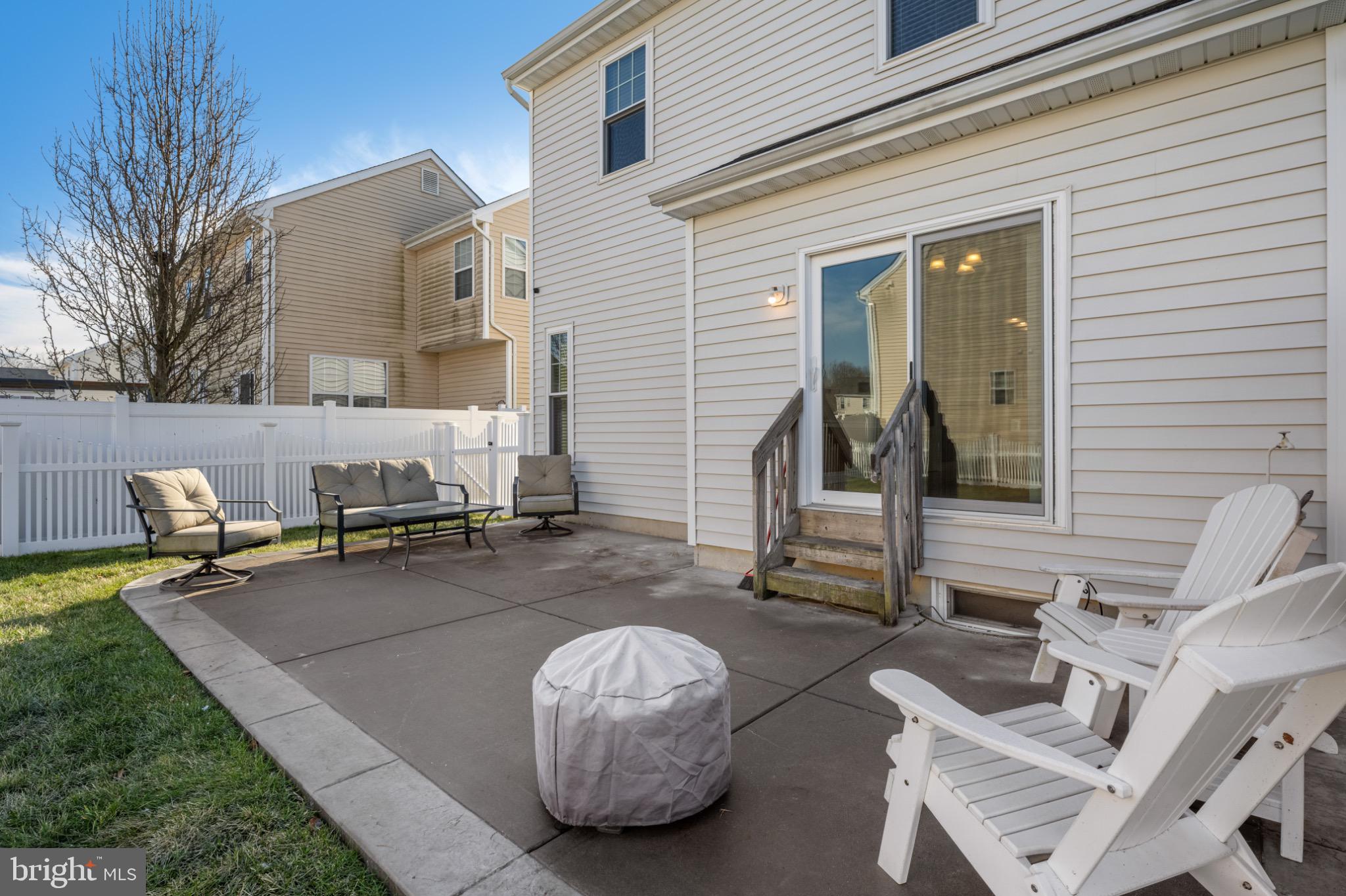 8 Porch Street Clayton, NJ 08312 - Photo 30 of 31 a view of a patio with a table and chairs and a barbeque