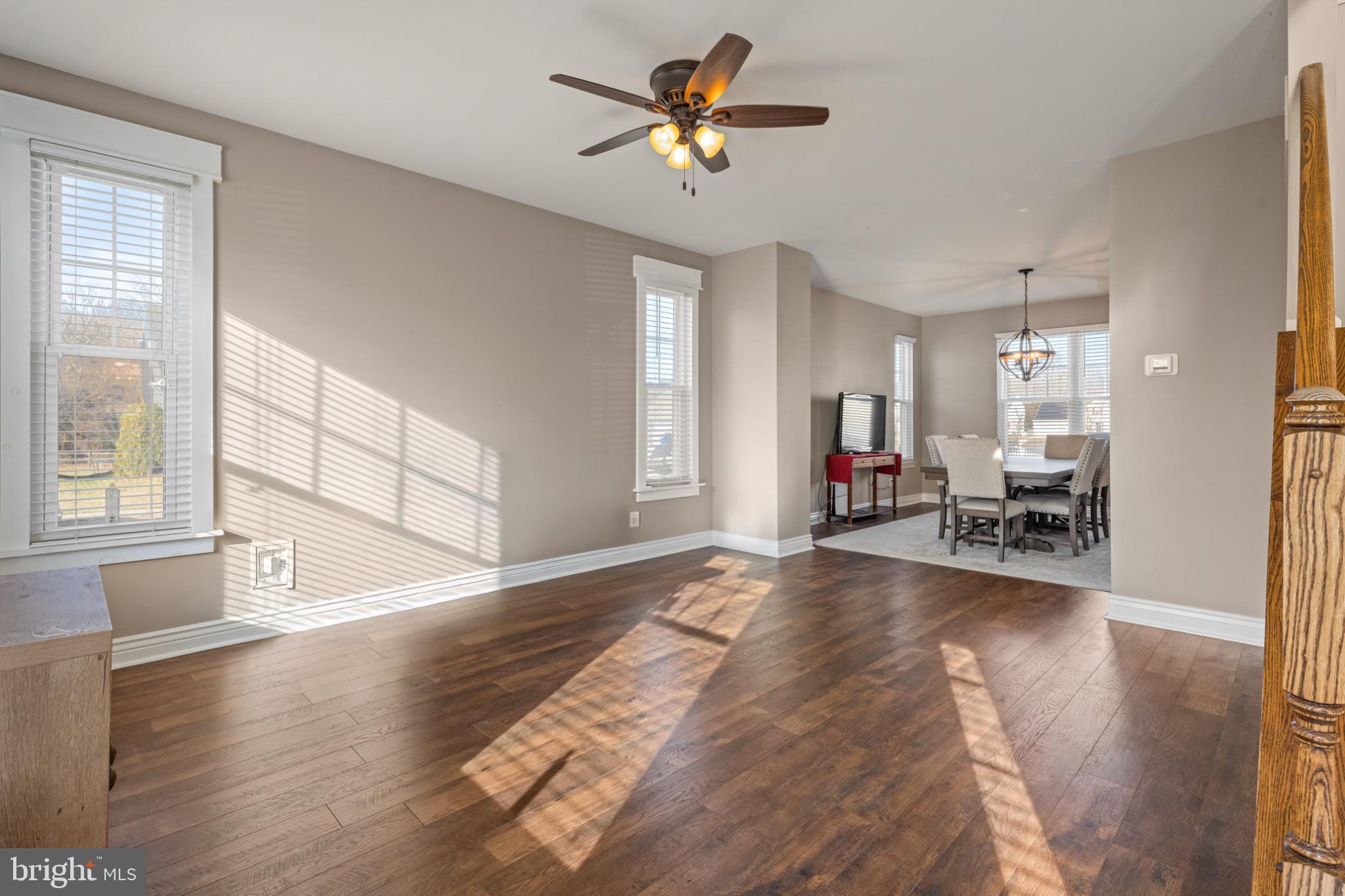 8 Porch Street Clayton, NJ 08312 - Photo 4 of 31 a view of a livingroom with furniture a ceiling fan and window