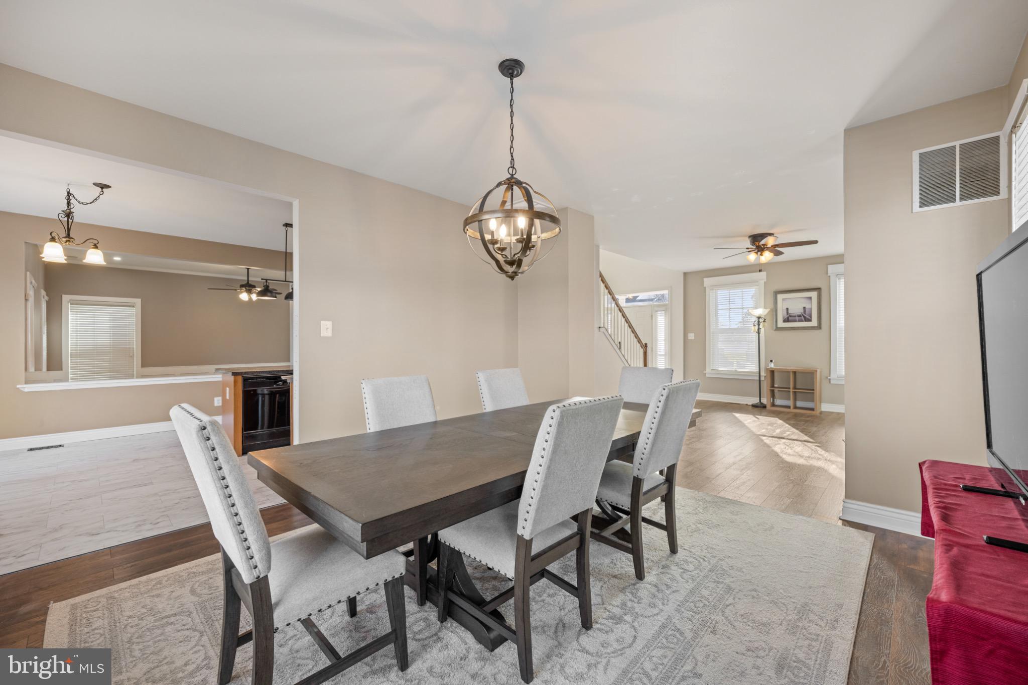 8 Porch Street Clayton, NJ 08312 - Photo 6 of 31 a view of a dining room with furniture wooden floor and a chandelier