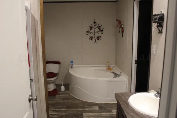 a white toilet sitting next to a bathroom sink