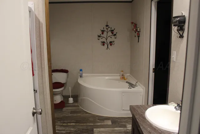 a white toilet sitting next to a bathroom sink