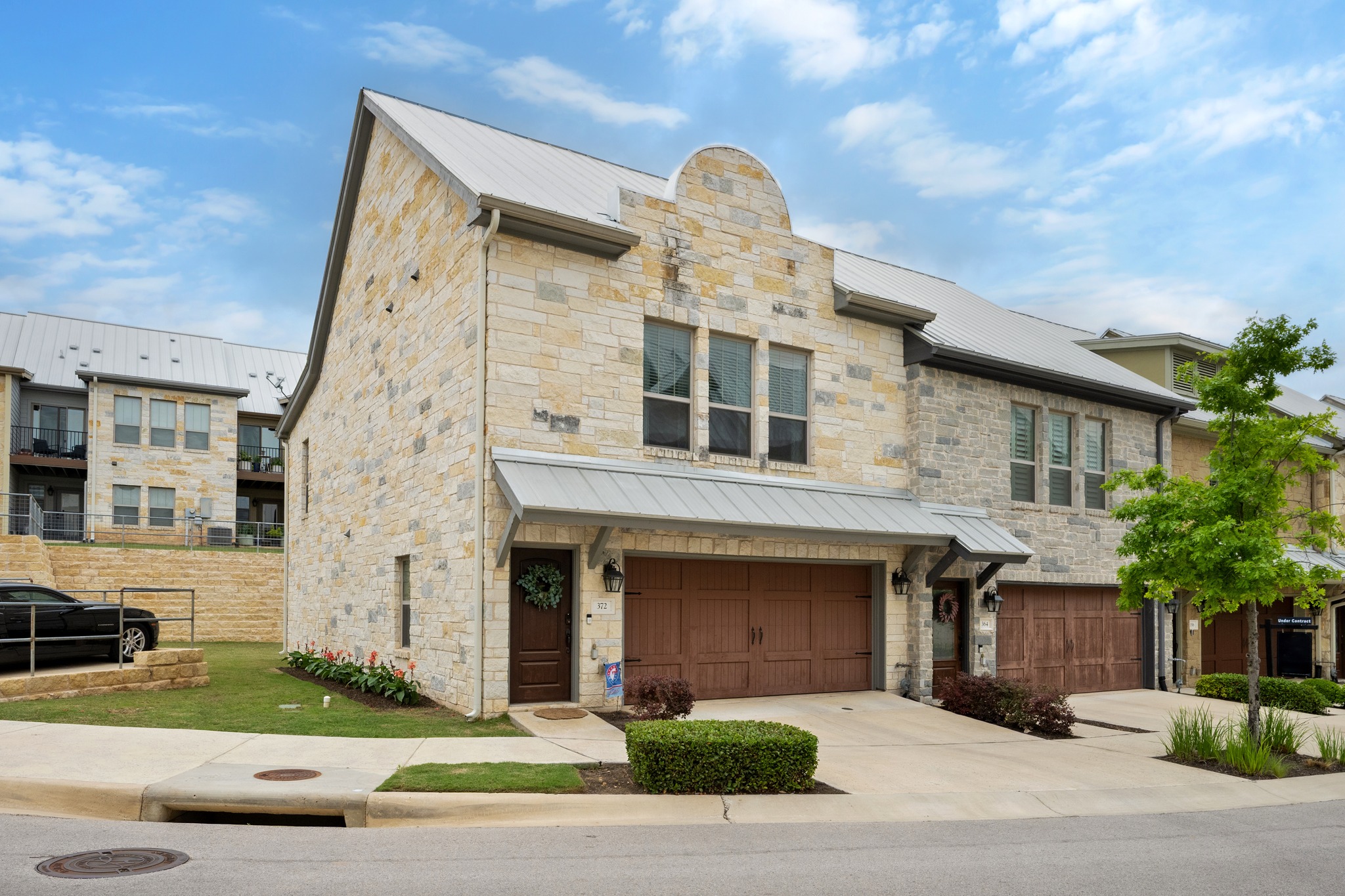 372 Adams Street Georgetown, TX 78628 - Photo 1 of 33 a front view of a house with garden