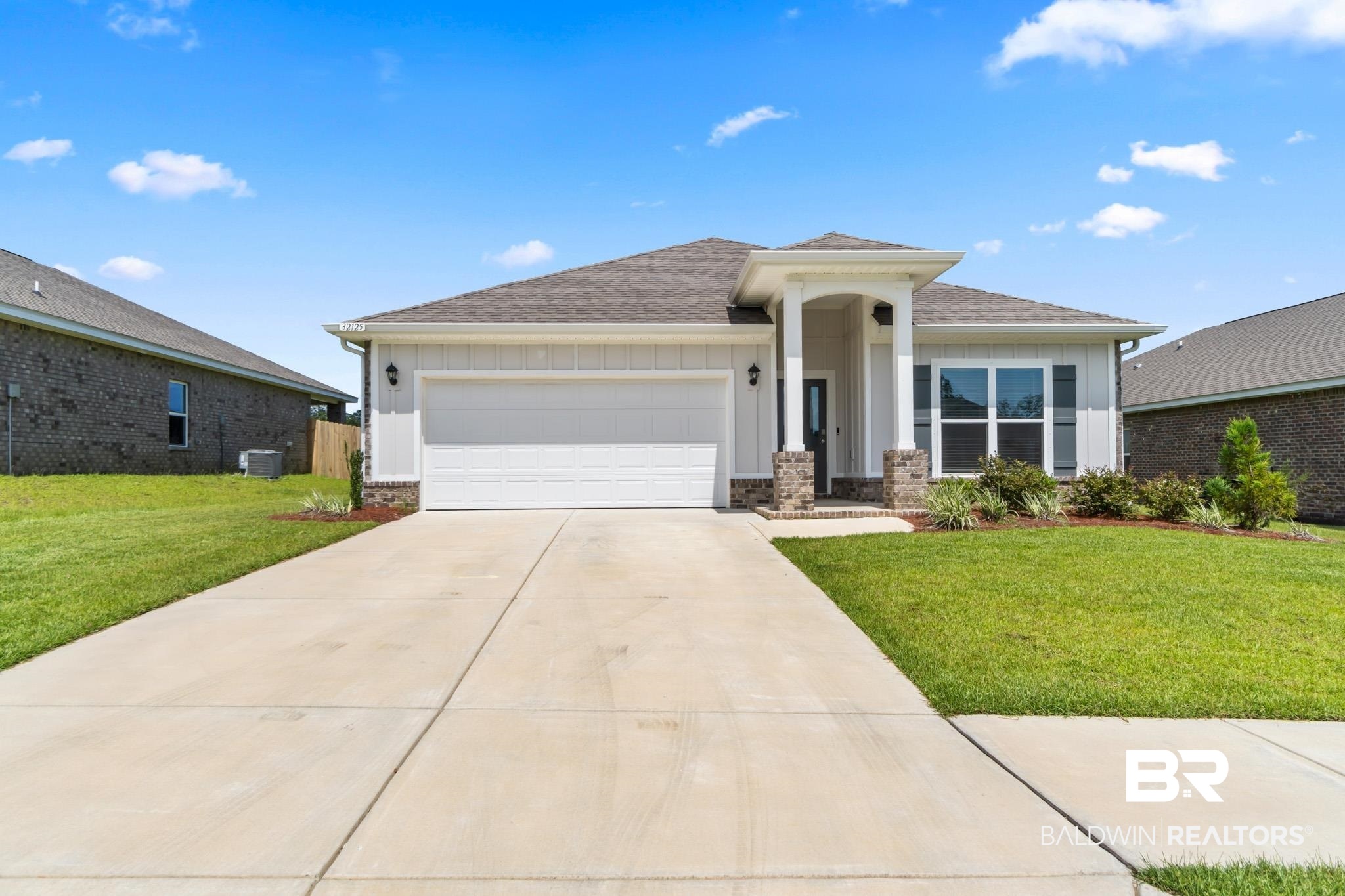 32125 Lyon Road Daphne, AL 36527 - Photo 1 of 70 Contemporary single-story residence with a light-colored siding facade