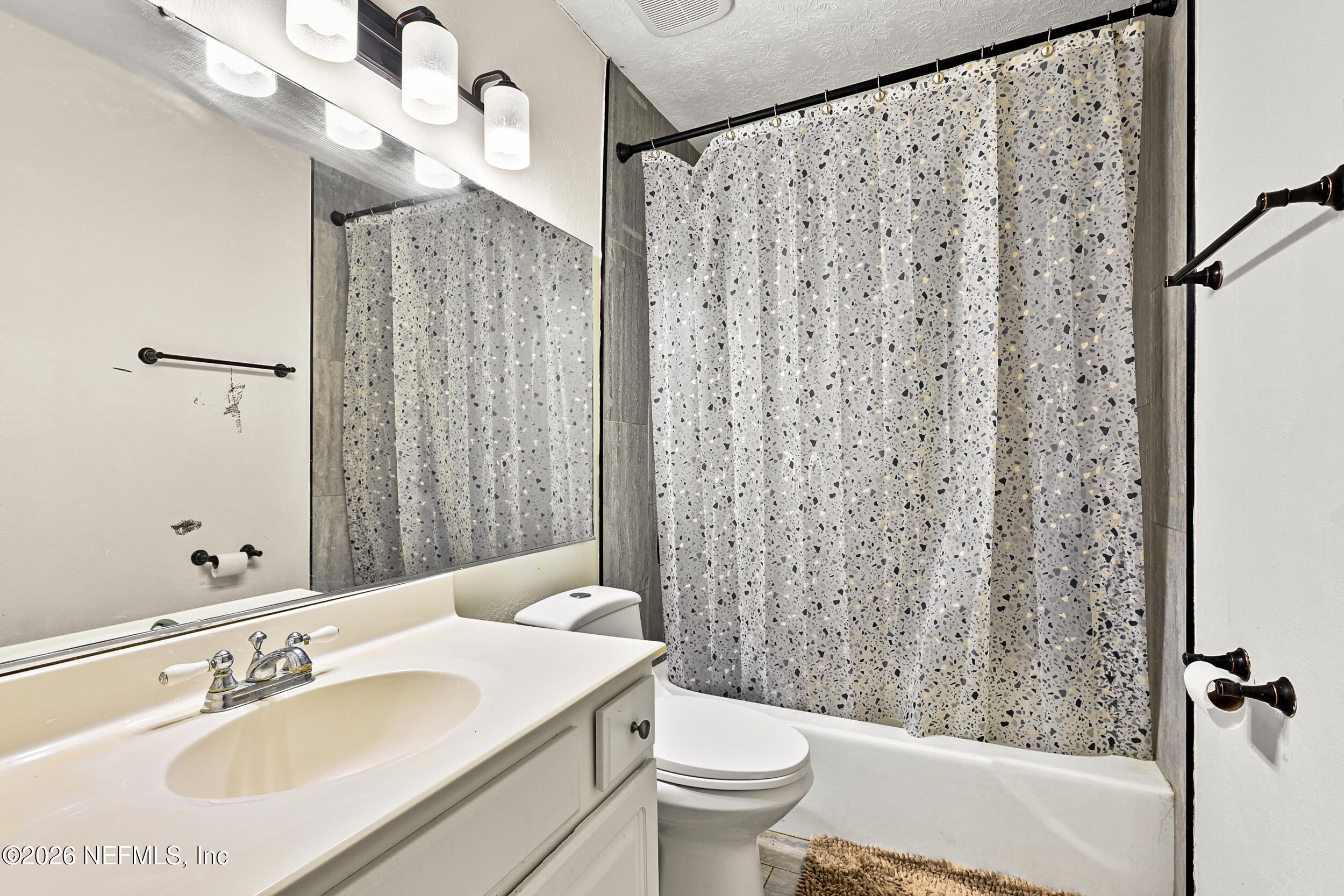 4915 Baymeadows Road, Unit 6G Jacksonville, FL 32217 - Photo 25 of 44 a bathroom with a sink toilet and shower