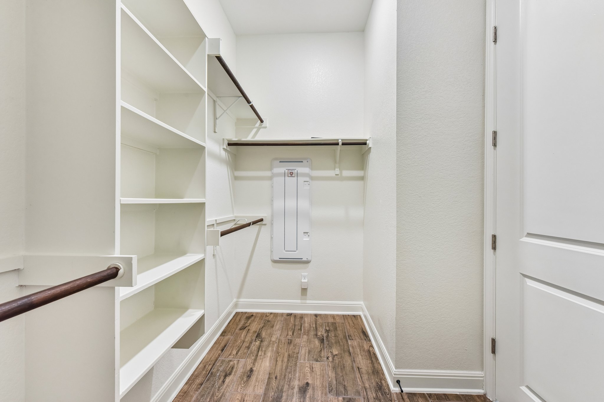 19113 Freeman Circle Austin, TX 78738 - Photo 9 of 37 Ample shelving and hanging space defines this well-appointed walk-in closet.
