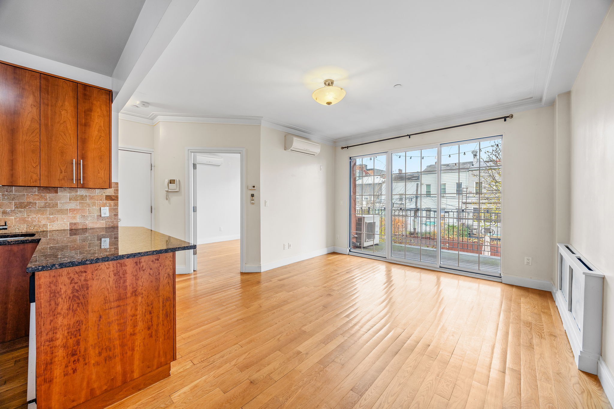175 12th Street, Unit 2B Brooklyn, NY 11215 - Photo 2 of 20 a view of wooden floor and cabinets in a room