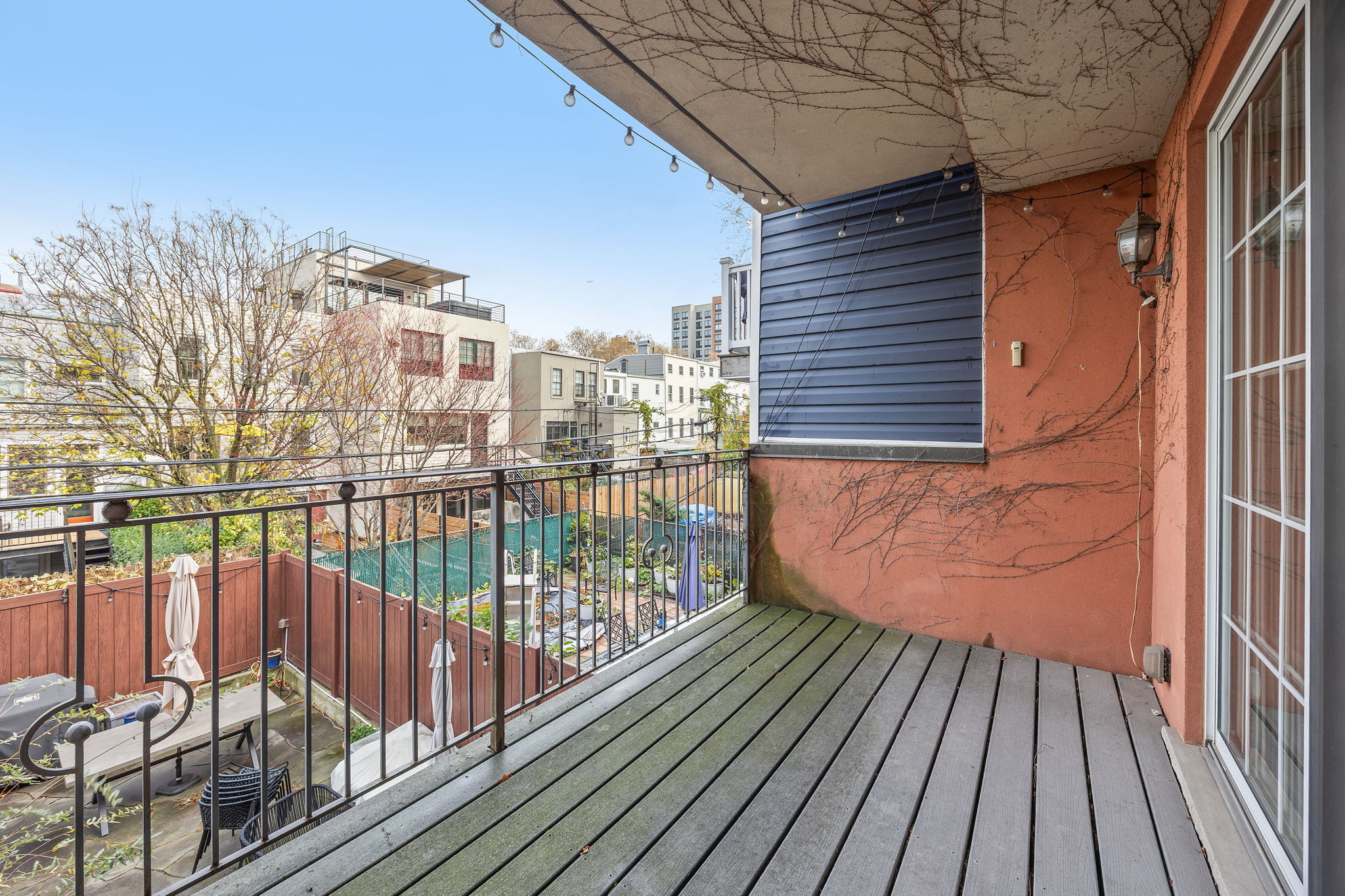 175 12th Street, Unit 2B Brooklyn, NY 11215 - Photo 8 of 20 a view of a balcony with wooden floor and fence and city view