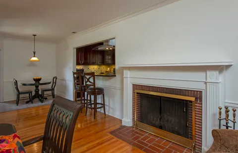 a view of a livingroom with furniture and a fireplace
