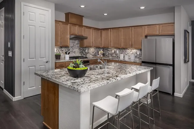 a kitchen with a table and chairs in it